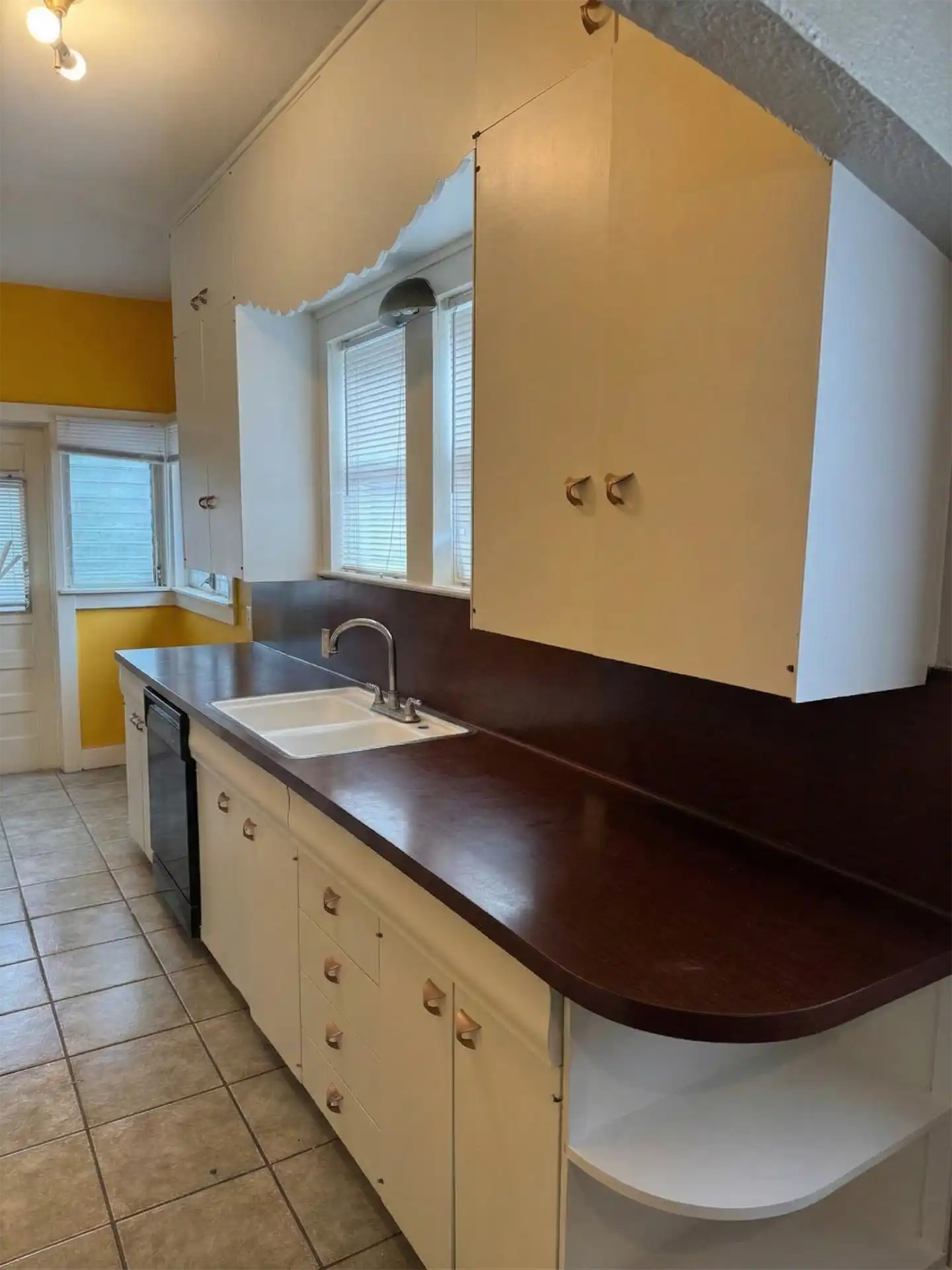 After shot of refinished white kitchen cabinets