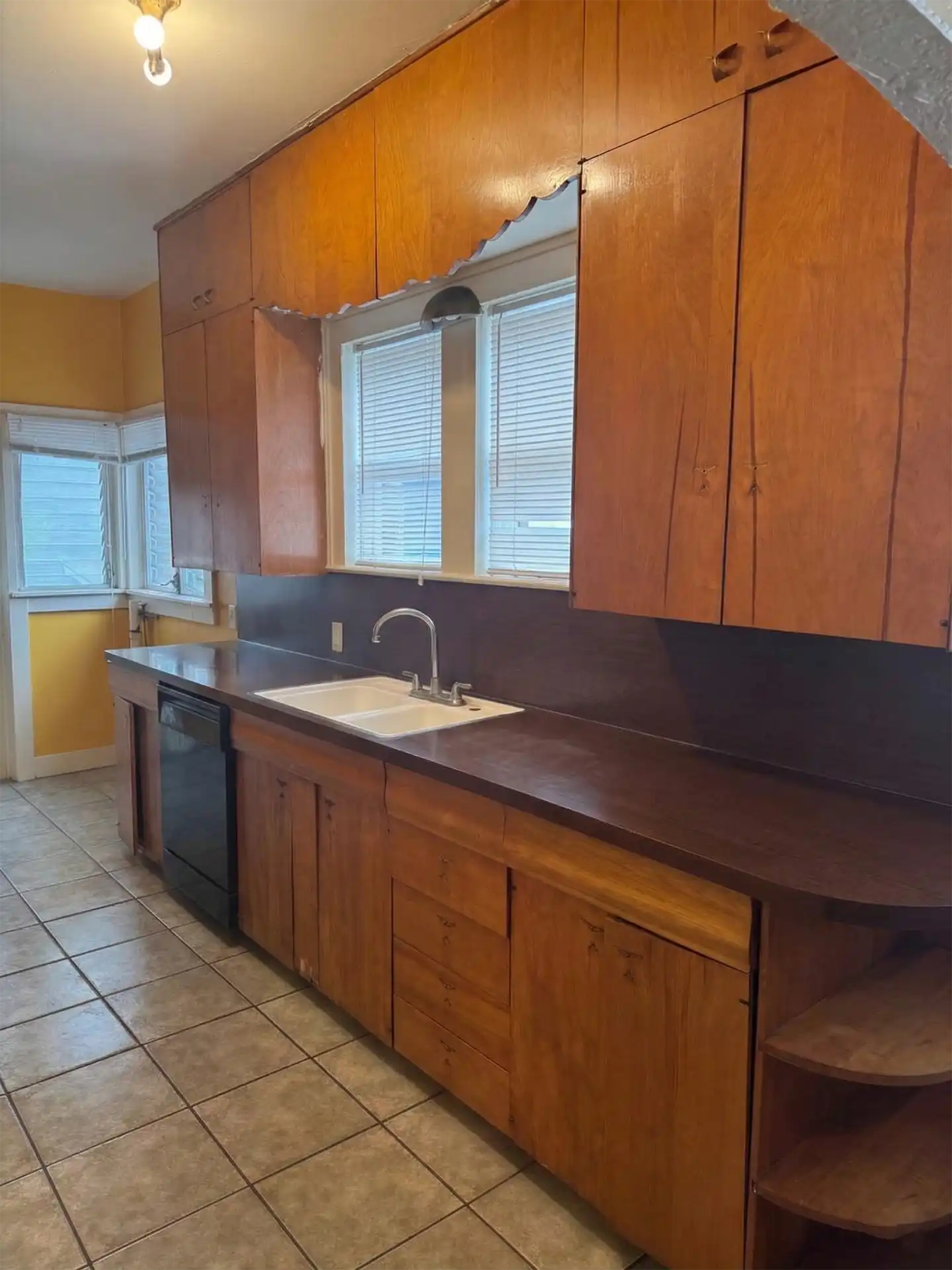Before shot of a kitchen cabinet refinishing project